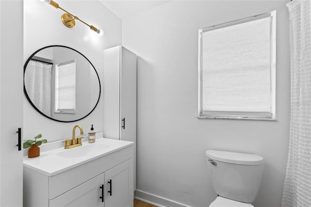 full bathroom featuring vanity and toilet