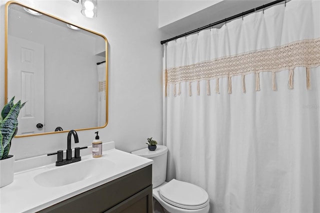 full bathroom featuring vanity and toilet