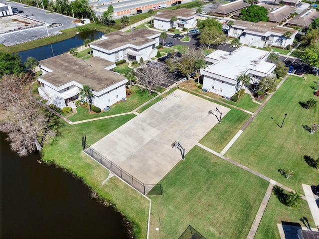 birds eye view of property with a residential view and a water view