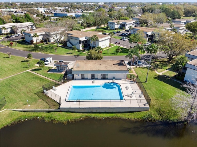 birds eye view of property featuring a residential view and a water view