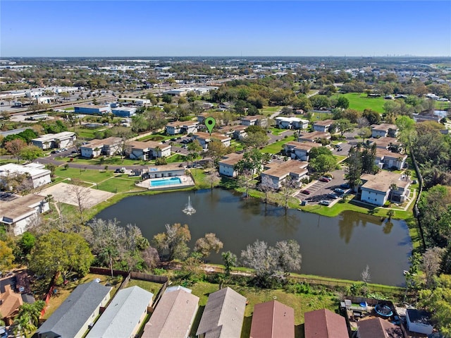 drone / aerial view with a residential view and a water view