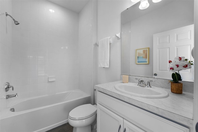 bathroom featuring toilet, shower / bathing tub combination, and vanity