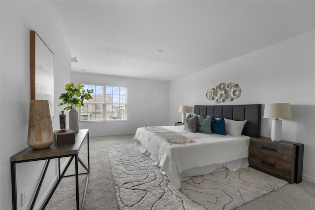 carpeted bedroom with baseboards