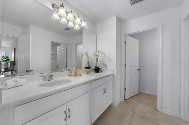 full bath with tile patterned flooring, visible vents, and a sink