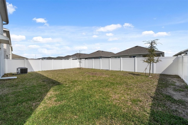 view of yard with a fenced backyard and cooling unit