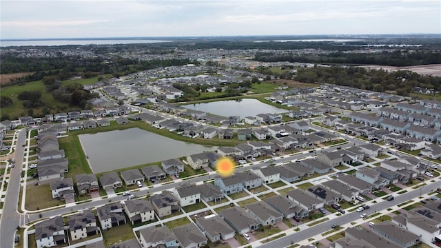 bird's eye view with a water view and a residential view