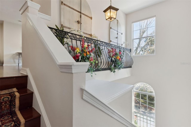 staircase with a towering ceiling