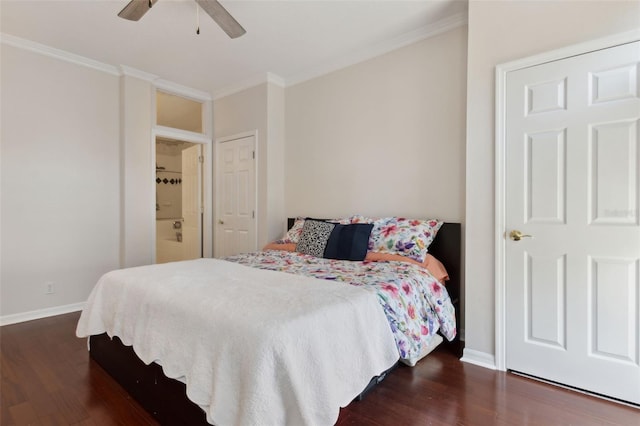 bedroom featuring baseboards, ornamental molding, and dark wood-type flooring