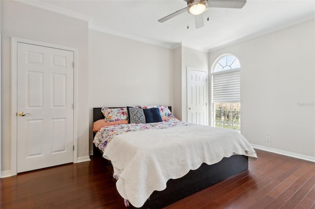 bedroom featuring ornamental molding, wood finished floors, a ceiling fan, and baseboards