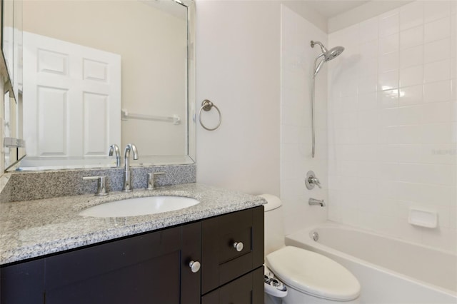 bathroom with toilet, tub / shower combination, and vanity