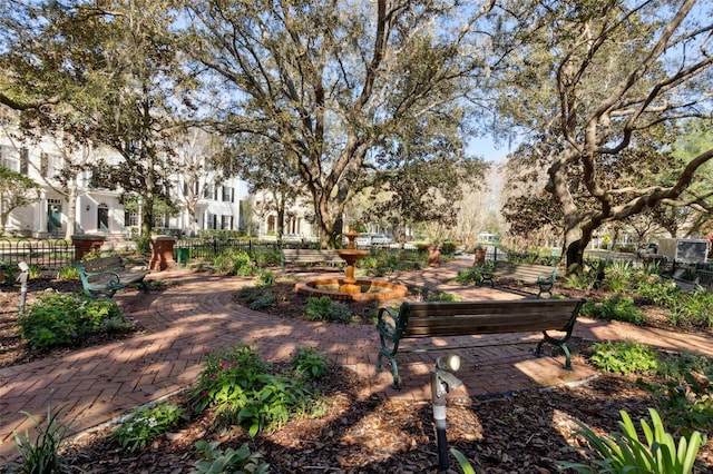 view of community with a residential view and fence