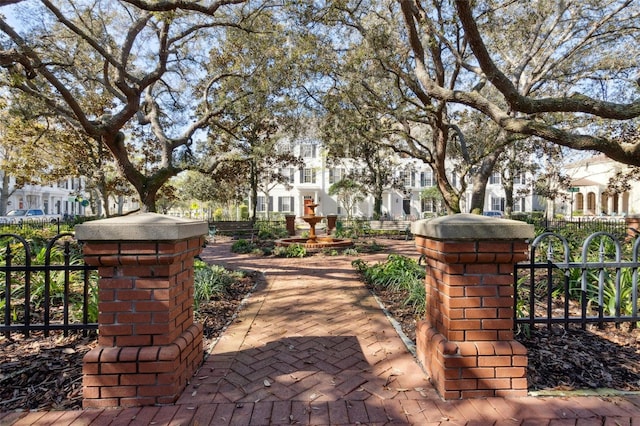 view of home's community featuring a residential view, a gate, and fence