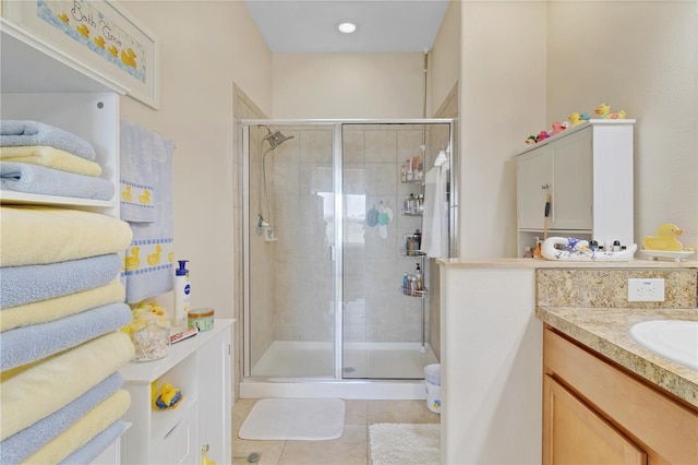 bathroom featuring a stall shower, vanity, and tile patterned floors