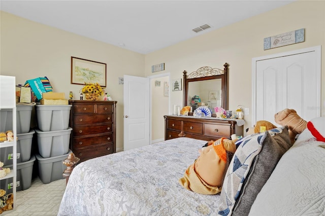 carpeted bedroom with visible vents