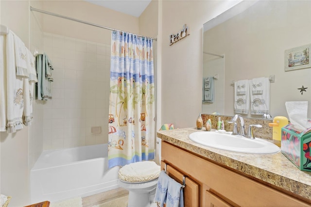 full bath featuring shower / tub combo, vanity, and toilet