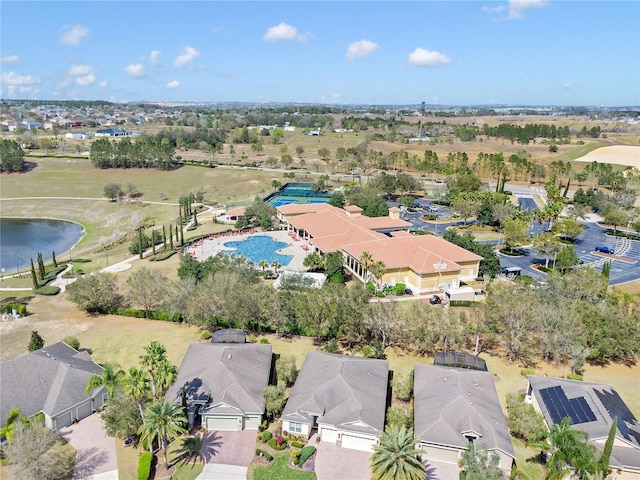 birds eye view of property featuring a water view and a residential view