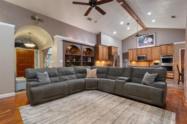 living room with a textured ceiling, high vaulted ceiling, wood finished floors, visible vents, and beamed ceiling