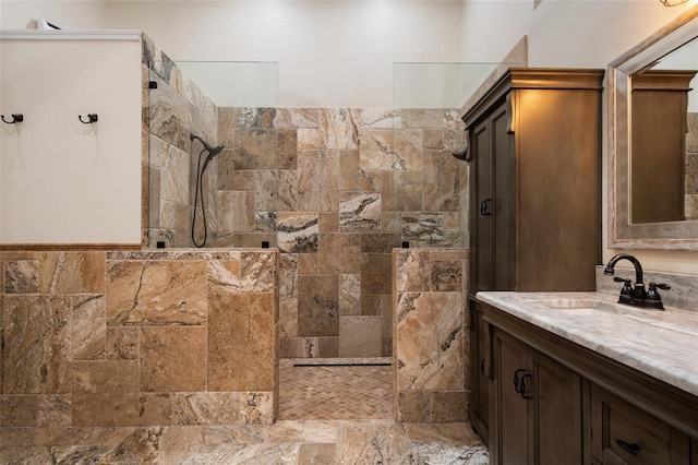 bathroom with walk in shower and vanity