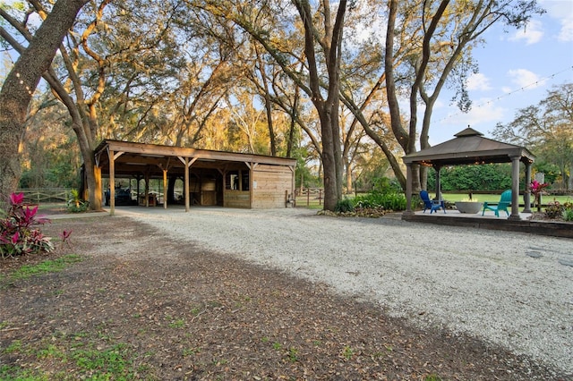 view of community with a gazebo, an outdoor structure, and an exterior structure