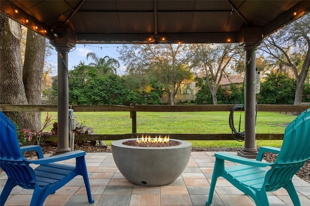 view of patio / terrace featuring a fire pit and a gazebo