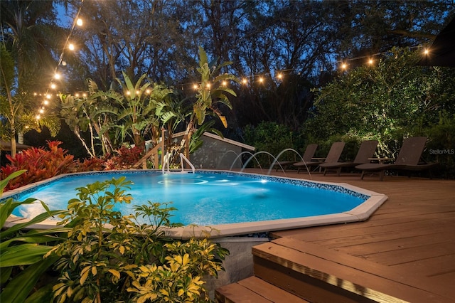 pool with a wooden deck