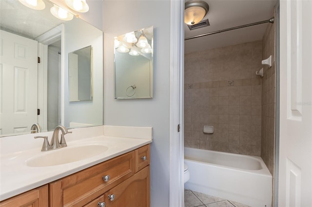 bathroom with visible vents, toilet, shower / tub combination, tile patterned flooring, and vanity