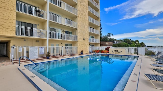 community pool featuring fence