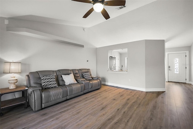 living room with lofted ceiling, visible vents, a ceiling fan, wood finished floors, and baseboards