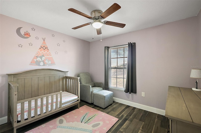 bedroom with a ceiling fan, baseboards, and wood finished floors