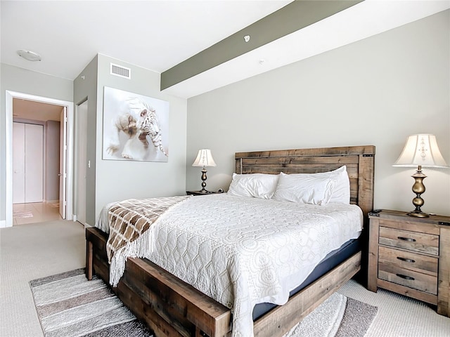 bedroom featuring light carpet and visible vents