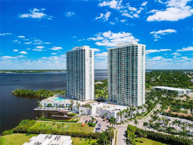 bird's eye view featuring a water view and a city view