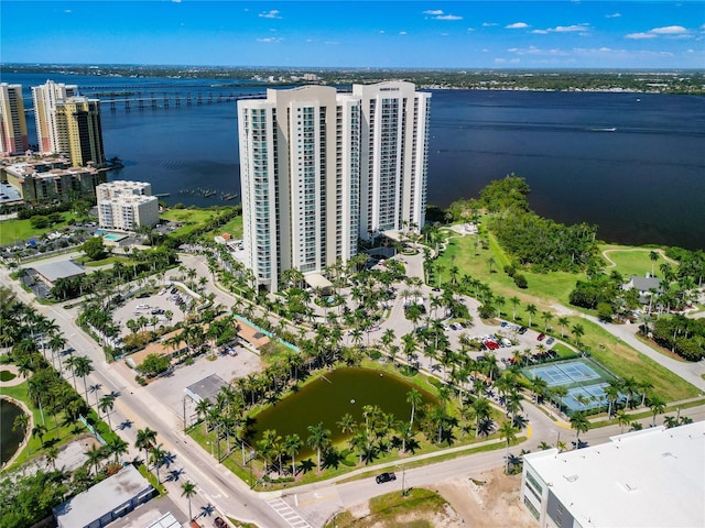 drone / aerial view featuring a water view and a view of city