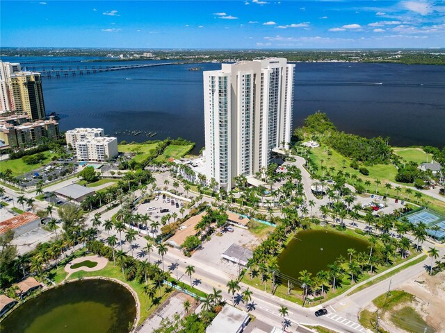 drone / aerial view featuring a water view and a city view