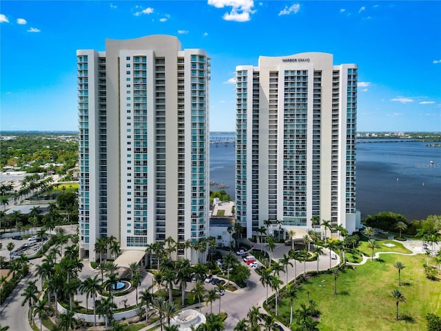 drone / aerial view with a view of city and a water view