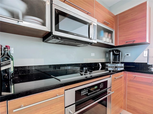 kitchen featuring dark countertops and stainless steel appliances