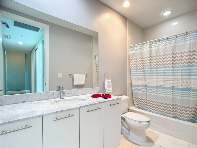 full bathroom with visible vents, toilet, shower / tub combo, vanity, and tile patterned flooring