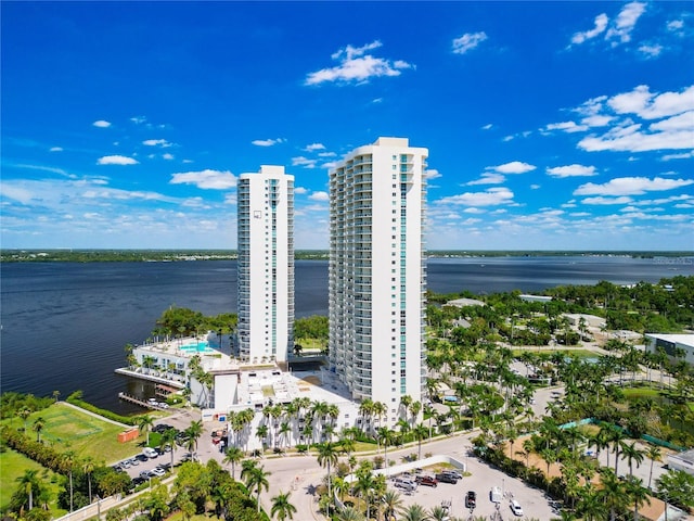 birds eye view of property with a water view