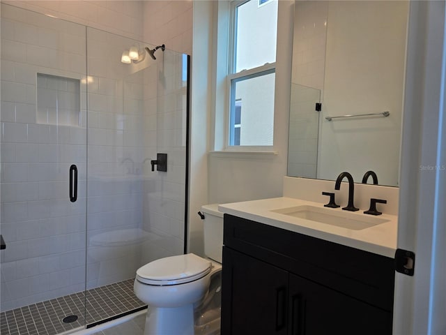 full bath featuring a shower stall, toilet, and vanity