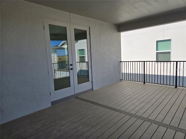 wooden deck featuring french doors