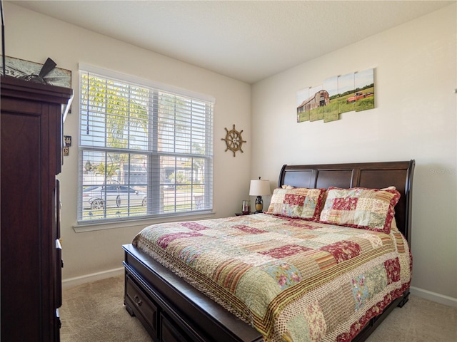 bedroom with carpet flooring and baseboards