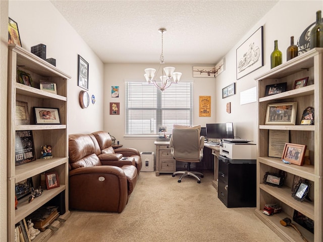 carpeted office featuring a notable chandelier and a textured ceiling