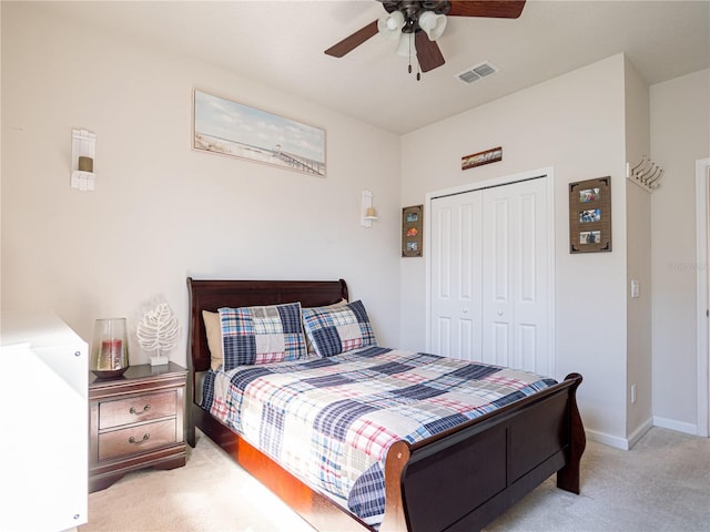 bedroom with carpet, a closet, visible vents, a ceiling fan, and baseboards