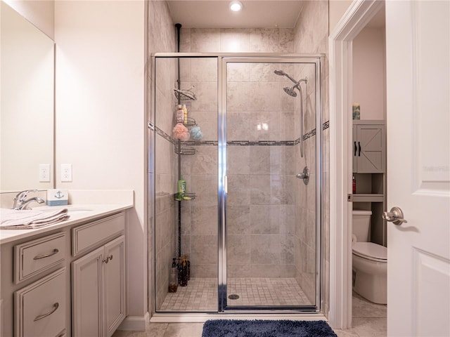 full bath with a shower stall, toilet, and vanity