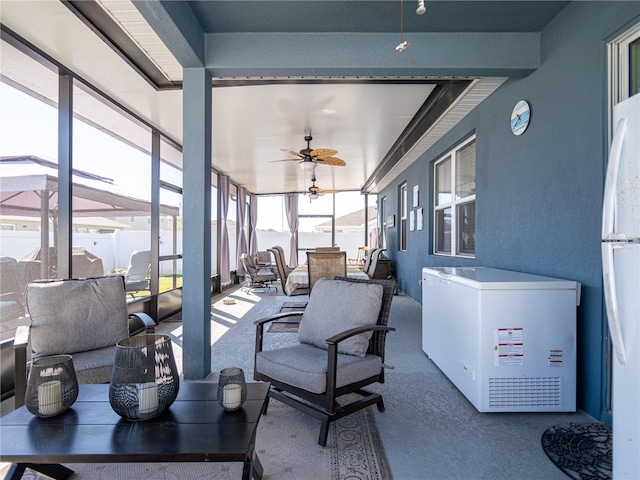 sunroom / solarium with ceiling fan