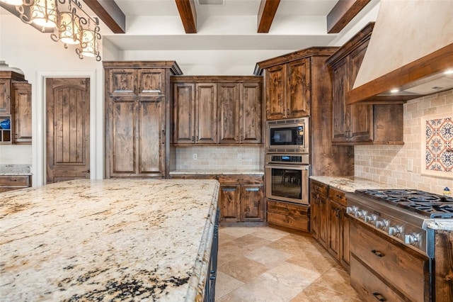 kitchen with beam ceiling, custom range hood, backsplash, appliances with stainless steel finishes, and light stone countertops