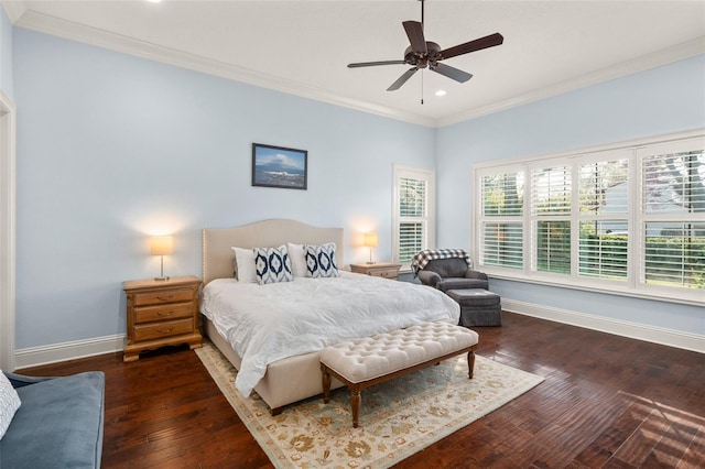 bedroom with ornamental molding, hardwood / wood-style flooring, and baseboards