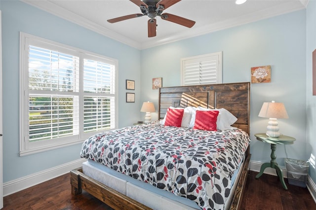 bedroom featuring ornamental molding, multiple windows, wood finished floors, and baseboards