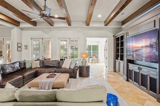 living room featuring light tile patterned floors, ceiling fan, visible vents, french doors, and beam ceiling