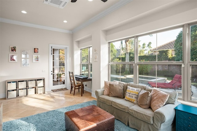 sunroom / solarium featuring plenty of natural light, visible vents, and a ceiling fan