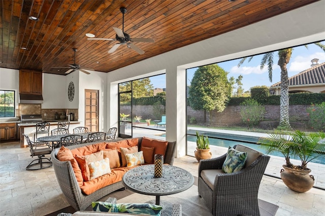 sunroom featuring wooden ceiling